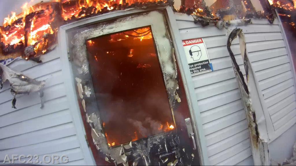 *View from Hoseman Owen helmet cam*

Hoseman Owen popping open a door to better help with fire attack. 